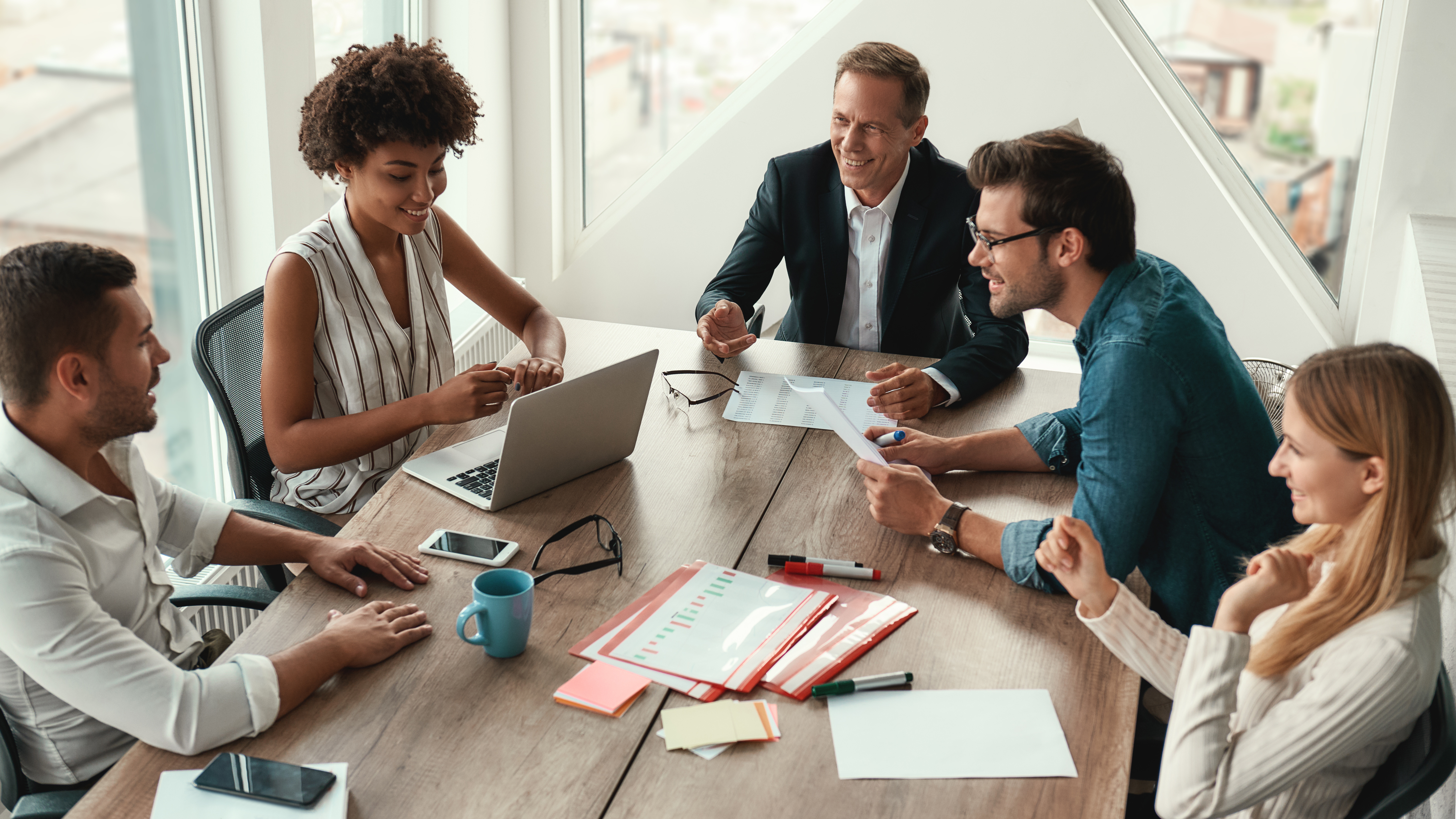 Diverse team collaborating around a conference table